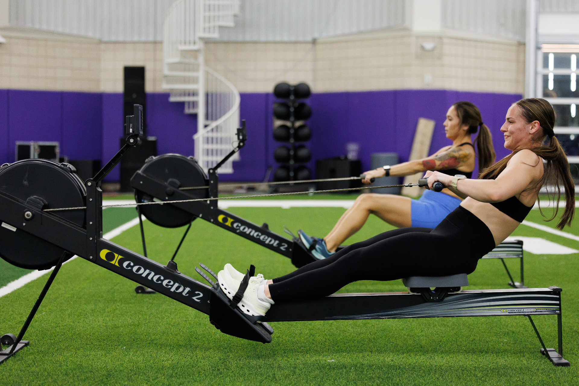 Two athletes on rowing machines