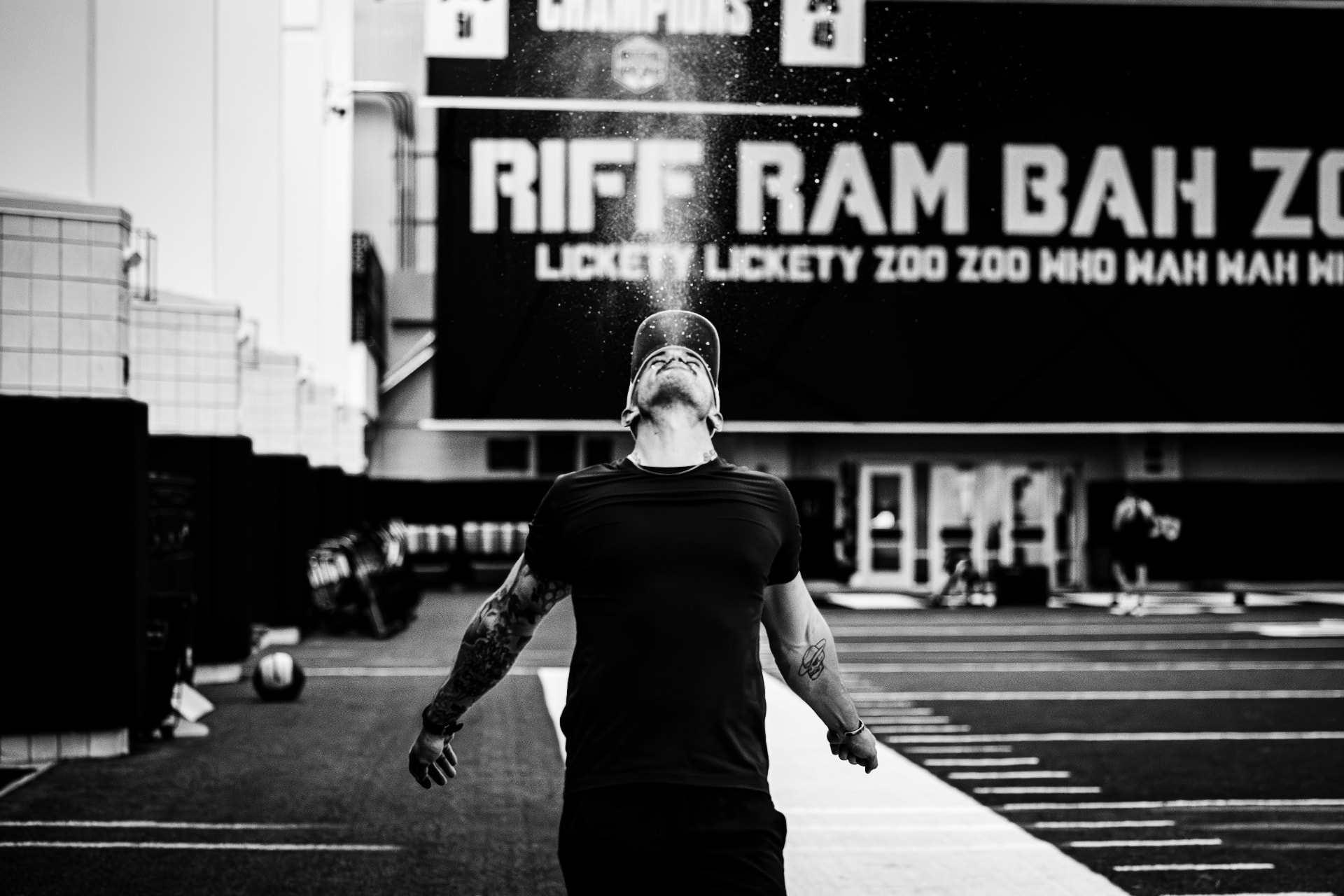 Athlete throwing chalk into the air before a lift